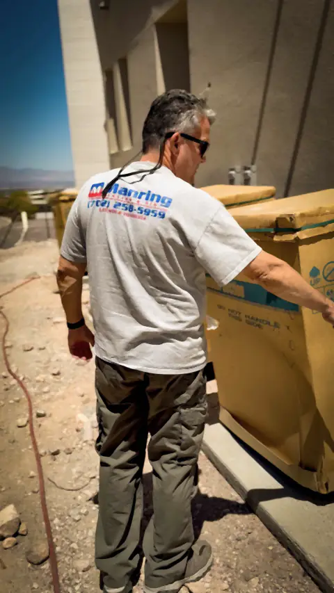 Inspecting a new air conditioning unit at a construction site